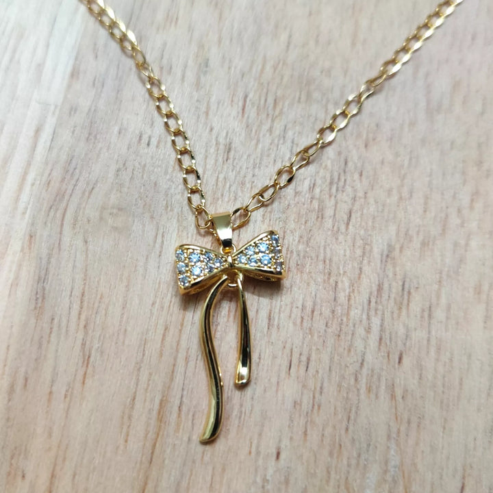 AD Bow Pendant in 18K Gold Plated Chain - Sparkleeng  Jewels