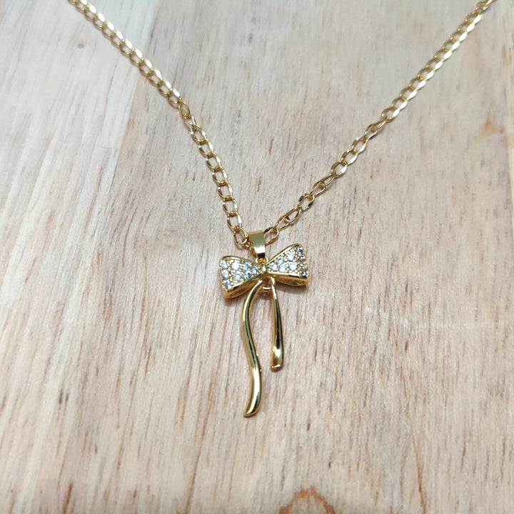 AD Bow Pendant in 18K Gold Plated Chain - Sparkleeng  Jewels